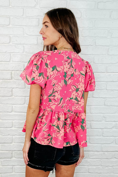 Blusa con mangas abullonadas y estampado floral