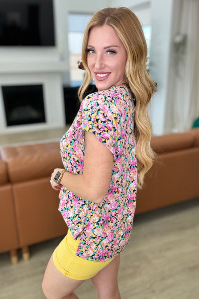 Blusa de manga corta Lizzy con estampado floral azul marino y rosa