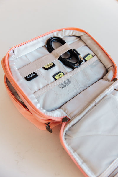 Estuche organizador de cables de viaje en color rosa