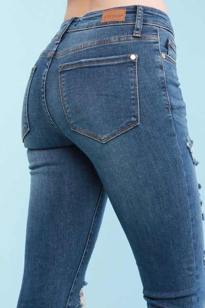 8829 Chelle Pantalones pitillo azules Judy destruidos de talle medio